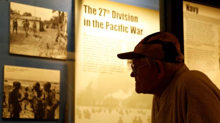 World War II veteran Arthur Robinson of Saratoga Springs views...