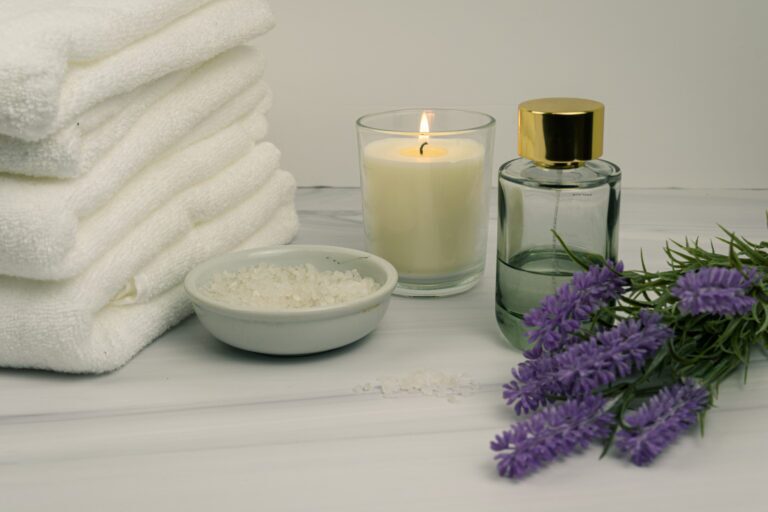 Home spa still life with towels, candle, bath salts and lavender