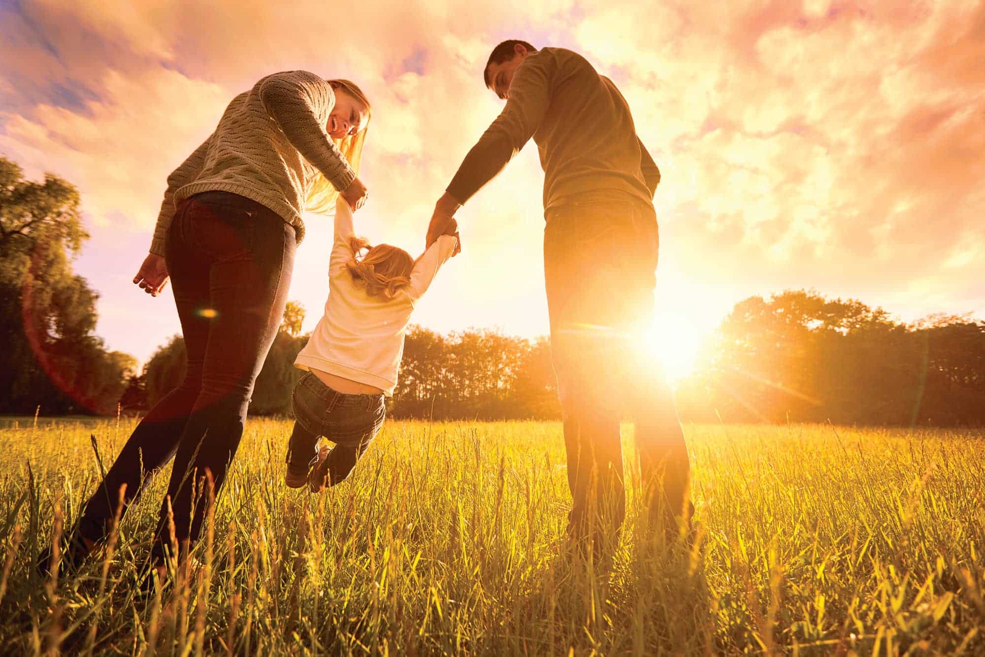 Parents with kid in field CMYK