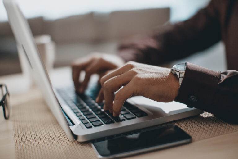 Vanderbilt Executive Essentials Package- hands typing on laptop computer